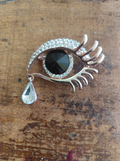 Broche vintage œil surréaliste dorée strass et larme pendante