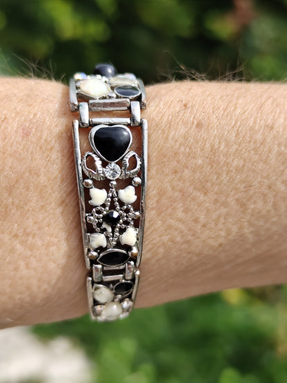 Bracelet rigide argenté articulé cœurs noir et blanc