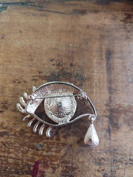 Broche vintage œil surréaliste dorée strass et larme pendante