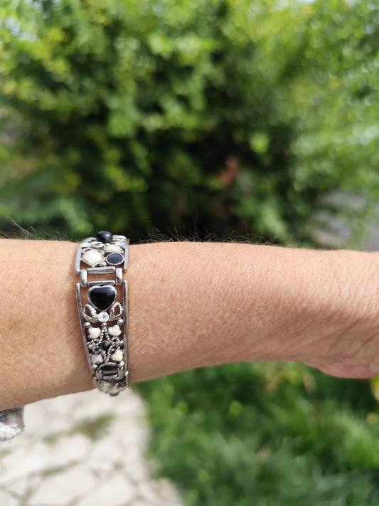 Bracelet rigide argenté articulé cœurs noir et blanc