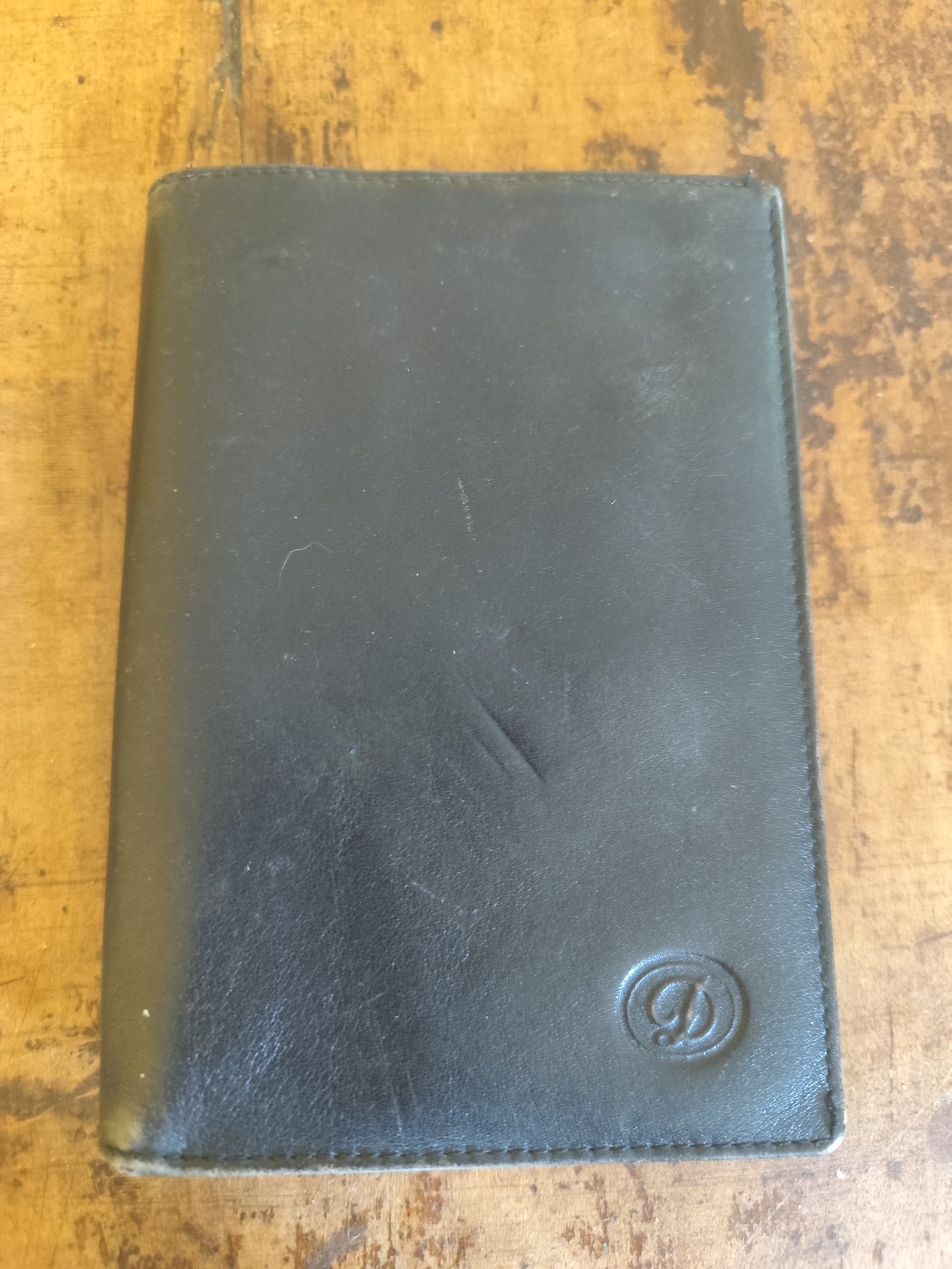 Portefeuille noir en cuir à volets multiples